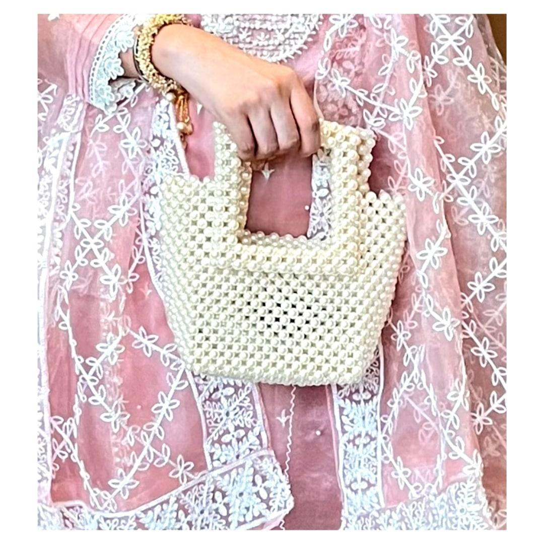 Pearl Bucket bag -  Pearl Bucket bag The bucket bag comes with everlasting finishing and shine. The bag is made of Arcylic pearl and come with a satin pouch Pearl Bucket bag Pearl Bucket bag The bucket bag comes with everlasting finishing and shine. The bag is made of Arcylic pearl and come with a satin pouch