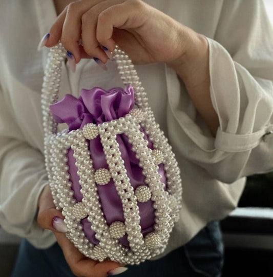 Pearl Purple Hue bucket bag -  Pearl bucket bag with detachable off white pouch inside Dimensions Height : 15 cm Shape: Cylinder Material : Faux High quality polished pearls with satin bag Pearl Purple Hue bucket bag Pearl bucket bag with detachable off white pouch inside Dimensions Height : 15 cm Shape: Cylinder Material : Faux High quality polished pearls with satin bag