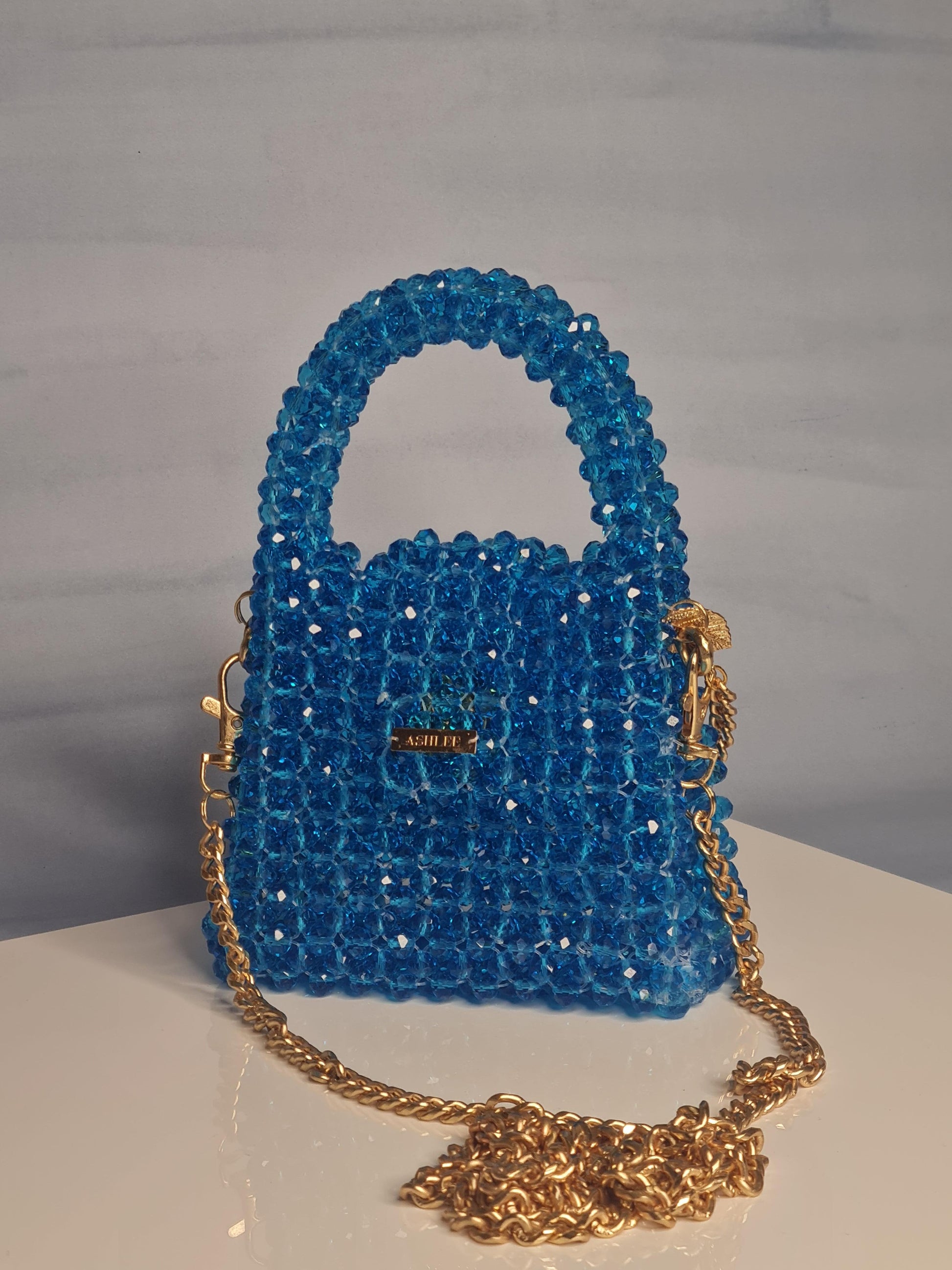 Nano Crystal Bag -  Nano crystal bag - Turquoise Blue Size : 12*10*8cm Crystal : Glass Sling : Yes Available on pre-order basis - 4 business days making time Nano Crystal Bag Nano crystal bag - Turquoise Blue Size : 12*10*8cm Crystal : Glass Sling : Yes Available on pre-order basis - 4 business days making time