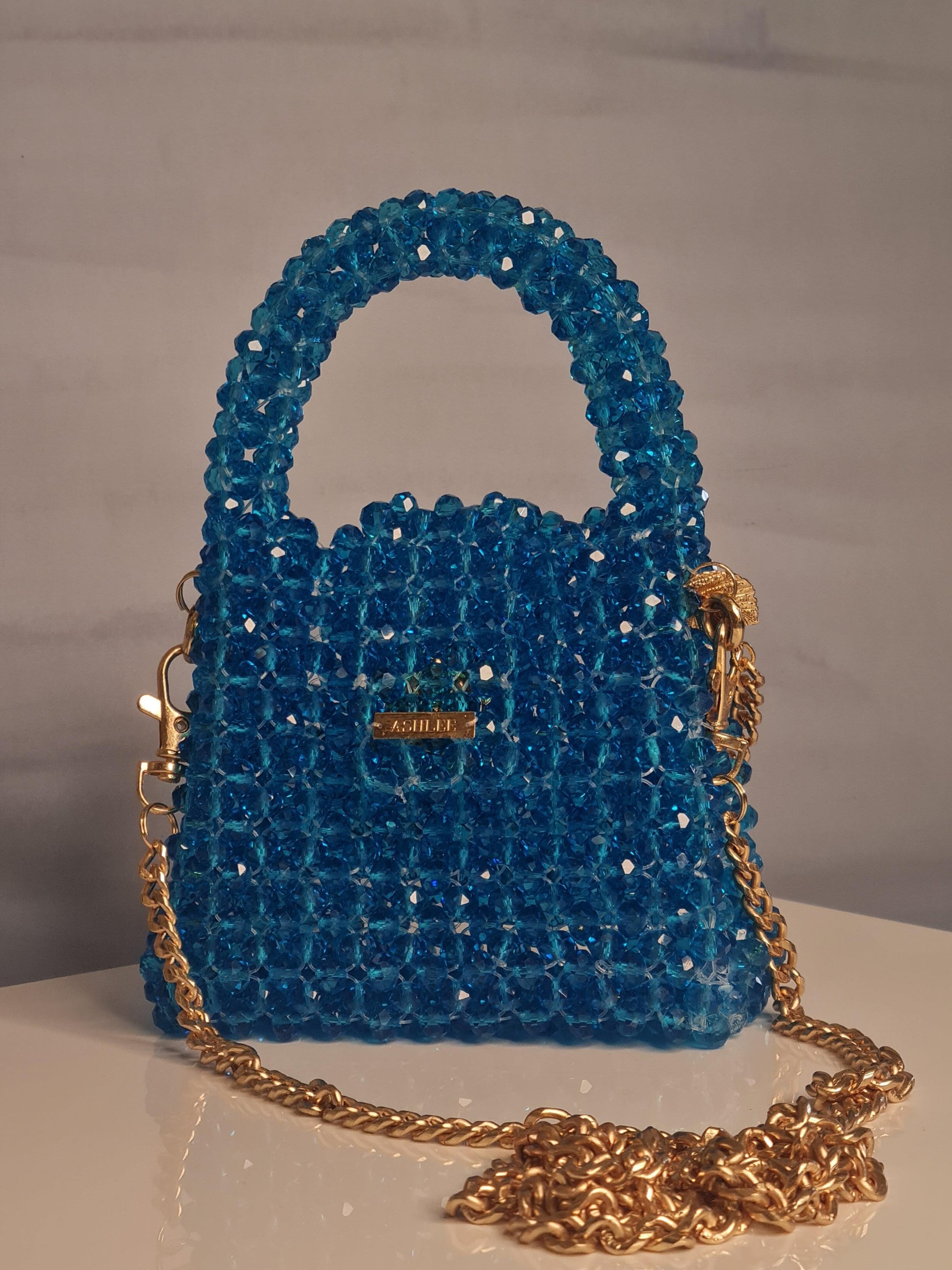 Nano Crystal Bag -  Nano crystal bag - Turquoise Blue Size : 12*10*8cm Crystal : Glass Sling : Yes Available on pre-order basis - 4 business days making time Nano Crystal Bag Nano crystal bag - Turquoise Blue Size : 12*10*8cm Crystal : Glass Sling : Yes Available on pre-order basis - 4 business days making time