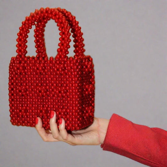 Red Pearl Bag -  Color : Red Luxe Pearl Lining: Yes, same as pearl color Sling: No Size: 6*6*3 inches Red Pearl Bag Color : Red Luxe Pearl Lining: Yes, same as pearl color Sling: No Size: 6*6*3 inches